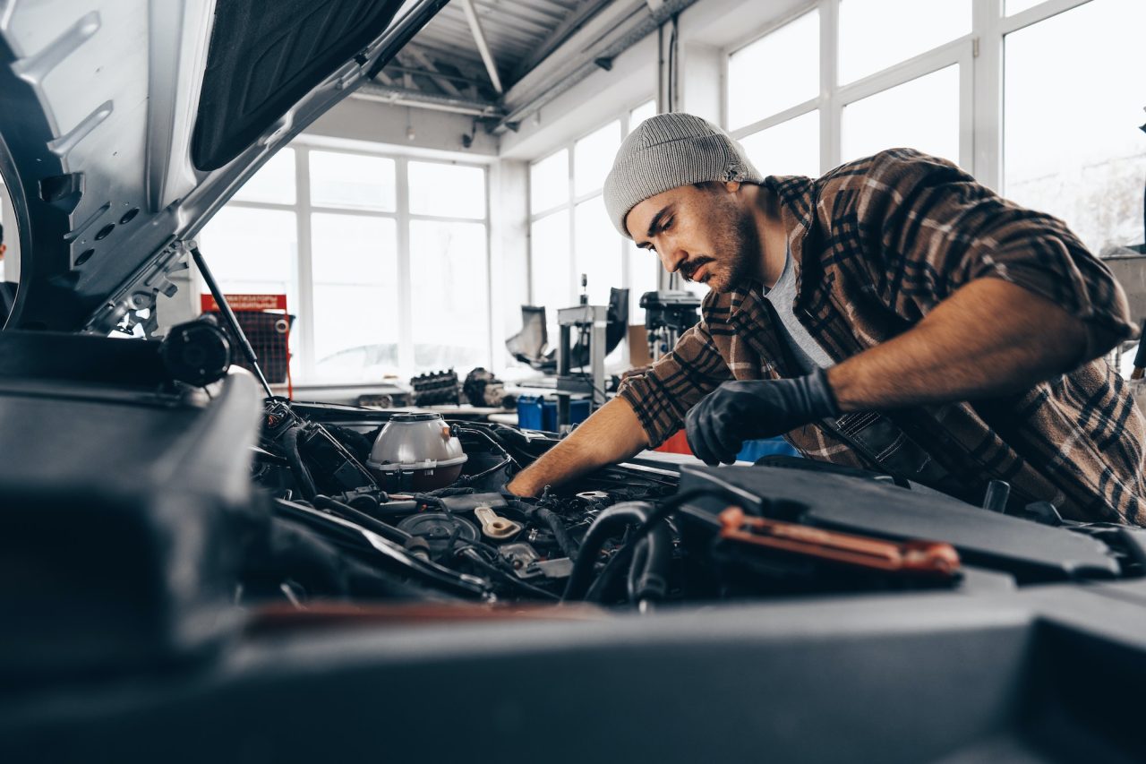 Mechanic working on car