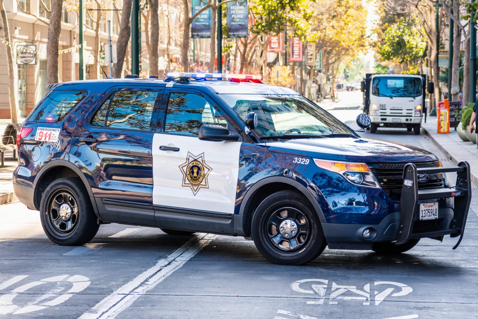 A police car blocking a road for traffic mitigation
